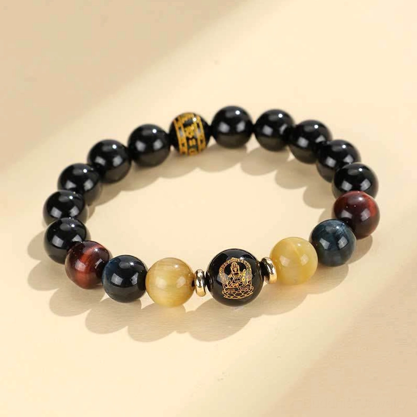 Black onyx tiger eye Om Mani Padme Hum bracelet flat lay on neutral background showing complete design