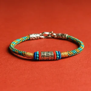 Om Mani Padme Hum Buddhist string bracelet with colorful woven threads and 925 sterling silver charm, front view