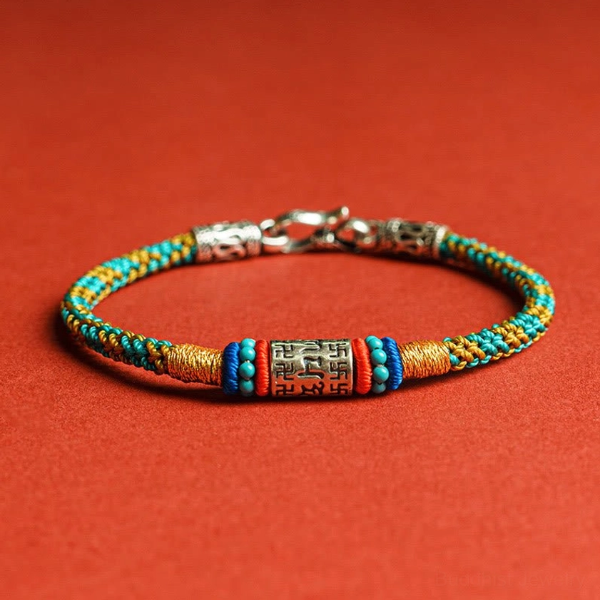 Om Mani Padme Hum Buddhist string bracelet with colorful woven threads and 925 sterling silver charm, front view