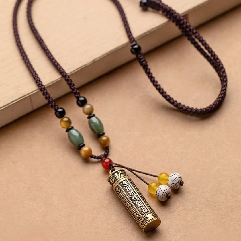 Authentic Buddhist mantra necklace with intricately engraved om mani padme hum pendant and natural gemstones