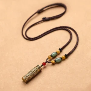 Om Mani Padme Hum Buddhist mantra necklace with engraved bronze pendant, agate and bodhi seed beads on braided cord