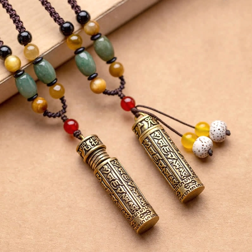 Pair of matching Buddhist mantra necklaces with hand-engraved cylindrical pendants in bronze and natural gemstones