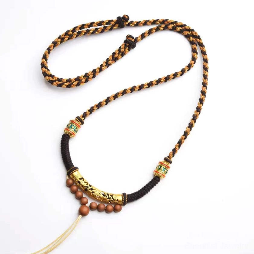 Om Mani Padme Hum Buddhist prayer necklace with King Kong knot, carved gold bead and wooden spacer beads white background