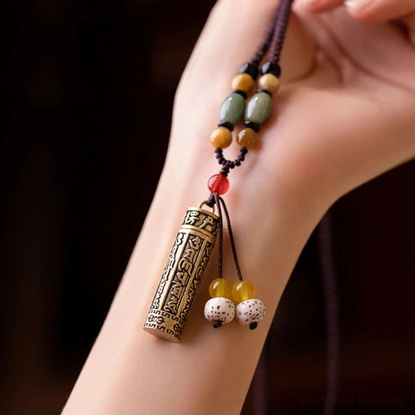 Buddhist protection necklace with hand-engraved mantra pendant featuring copper and natural stone beads