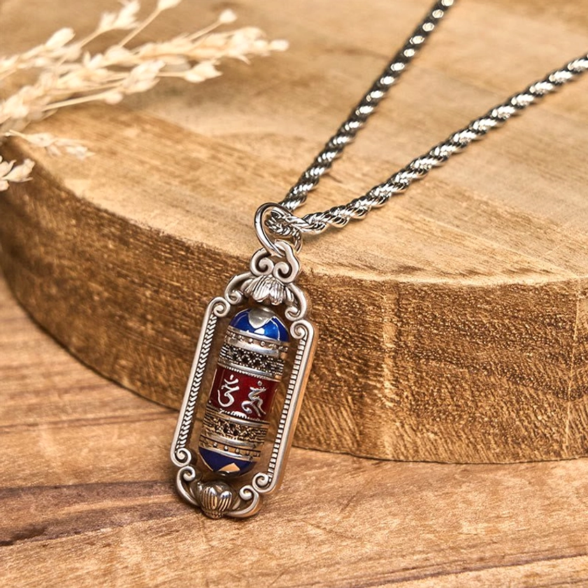 Buddhist Om Mani Padme Hum pendant necklace three-quarter front view with vintage silver frame and colored enamel mantra