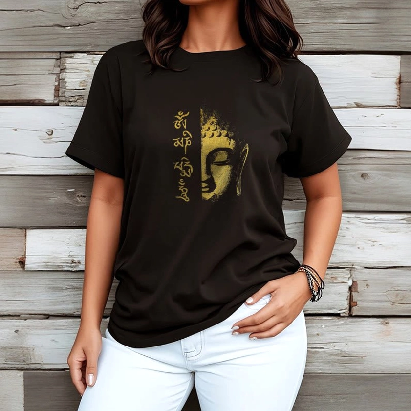 Women wearing Om Mani Padme Hum Buddhist spiritual t-shirt with gold Buddha design on white denim