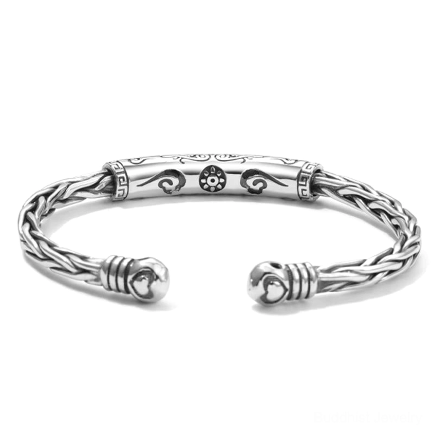 Tibetan style open cuff bangle with cloud and floral carved patterns and heart-shaped end caps