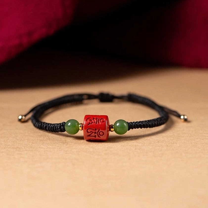 Black braided rope Om Mani Padme Hum cinnabar bracelet for protection and spiritual awareness, product showcase