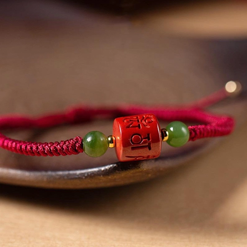 Side profile of Om Mani Padme Hum cinnabar bracelet showing bead arrangement and braided rope construction