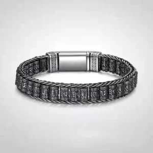 Om Mani Padme Hum copper Buddhist bracelet with engraved mantra text and magnetic buckle, front view on light background