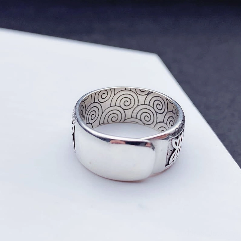 Om Mani Padme Hum adjustable copper Buddhist ring flatlay product photography