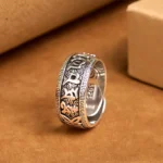 Om Mani Padme Hum copper adjustable open ring with engraved Sanskrit mantras, top view on kraft paper background