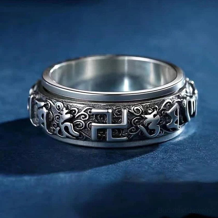 Om Mani Padme Hum copper spinner ring top front view showing engraved sacred mantra and swastika symbol