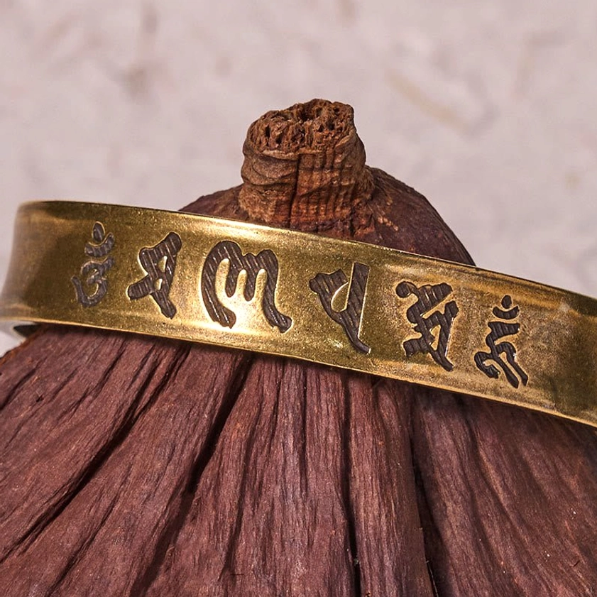 Six True Words Om Mani Padme Hum open cuff bracelet with embossed Sanskrit mantras on wooden lotus