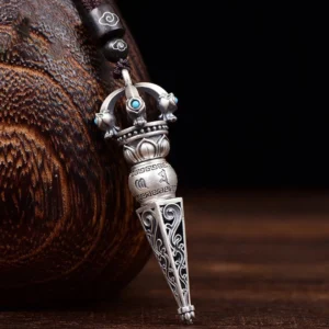 Rotatable Om Mani Padme Hum Dorje Vajra pendant necklace with turquoise inlays and carved Buddhist scriptures, displayed on wooden craft background