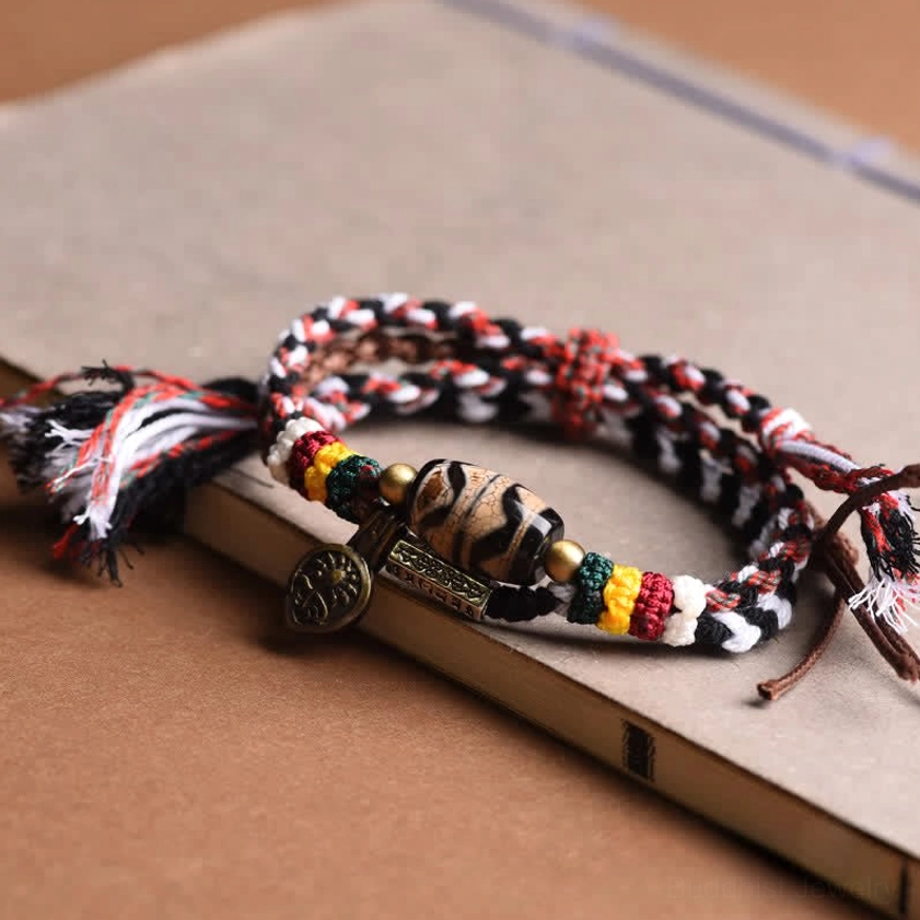Om Mani Padme Hum Buddhist bracelet with copper charm and protective amulet dzi bead side profile