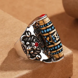 Om Mani Padme Hum Garuda rotatable meditation ring with Dzi bead pattern and turquoise inlays, left 3/4 angle view