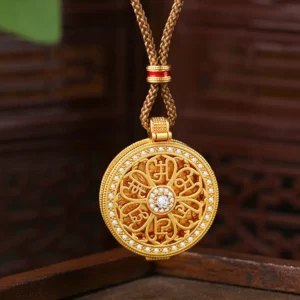Om Mani Padme Hum openable gold pendant necklace on dark wooden background, showcasing intricate hollowed six-syllable mantra design with cubic zirconia center stone