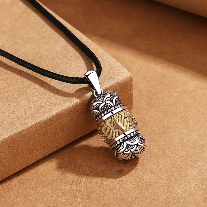 Buddhist prayer pendant with black braided leather cord - hand-carved copper with intricate spiritual symbolism