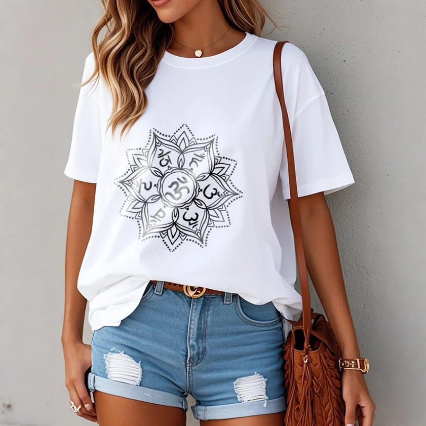 Woman wearing white Om Mani Padme Hum Mandala Buddhist T-Shirt with jeans and crossbody bag, casual spiritual style