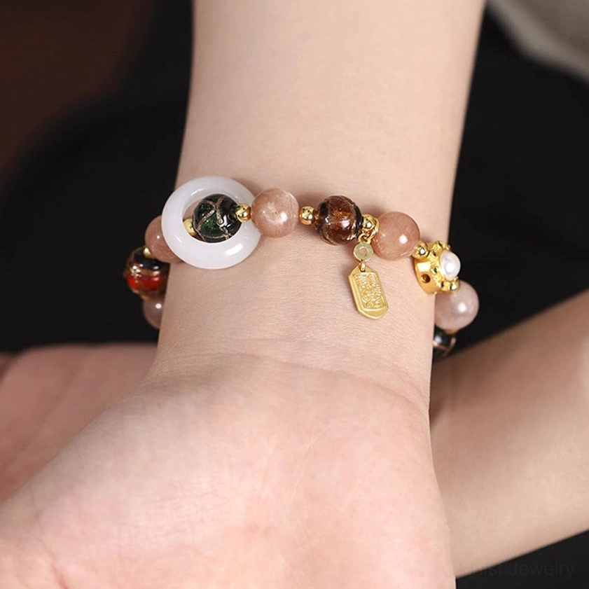 Om Mani Padme Hum mantra bracelet featuring copper prayer wheel charm and sacred spiritual beads