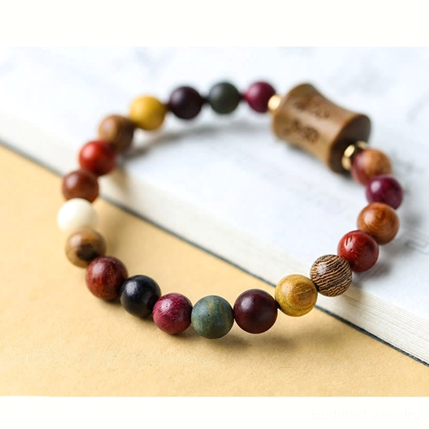 Multicolor sandalwood Om Mani Padme Hum bracelet showing complete design and bead arrangement on neutral background