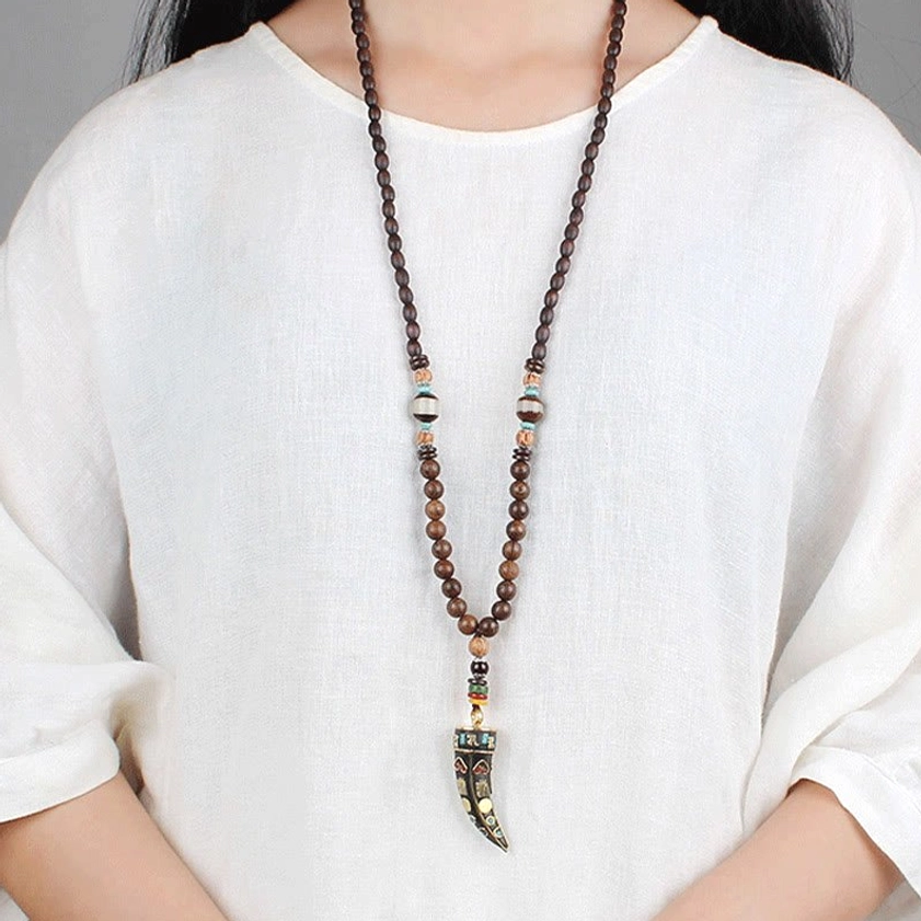 Buddhist om mani padme hum necklace worn on female model at chest