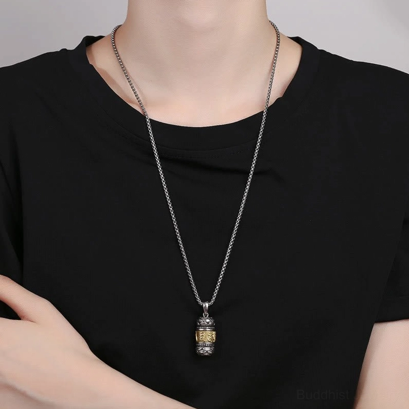 Wearable Buddhist mantra necklace styled on model wearing black t-shirt - pendant hangs at lower collarbone