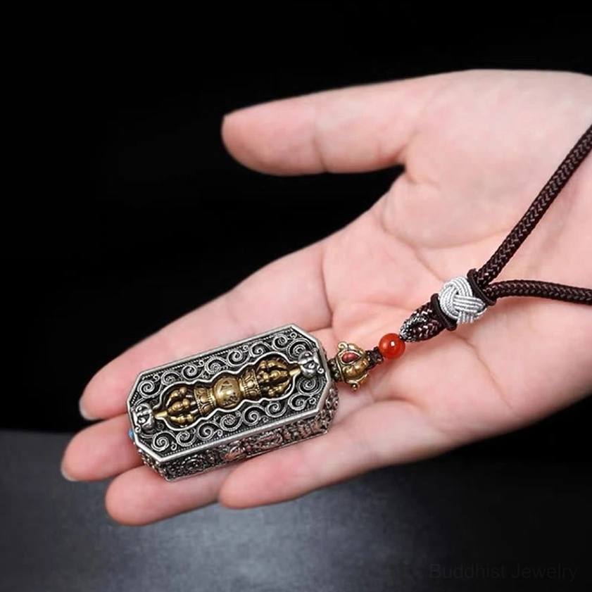 Om mani padme hum pendant on brown braided leather-style cord with red bead accents and engraved mantra