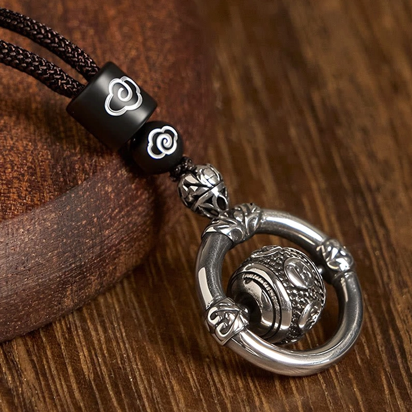 Om Mani Padme Hum rotating copper pendant Buddhist necklace detail shot showing craftsmanship and engraved mantra design