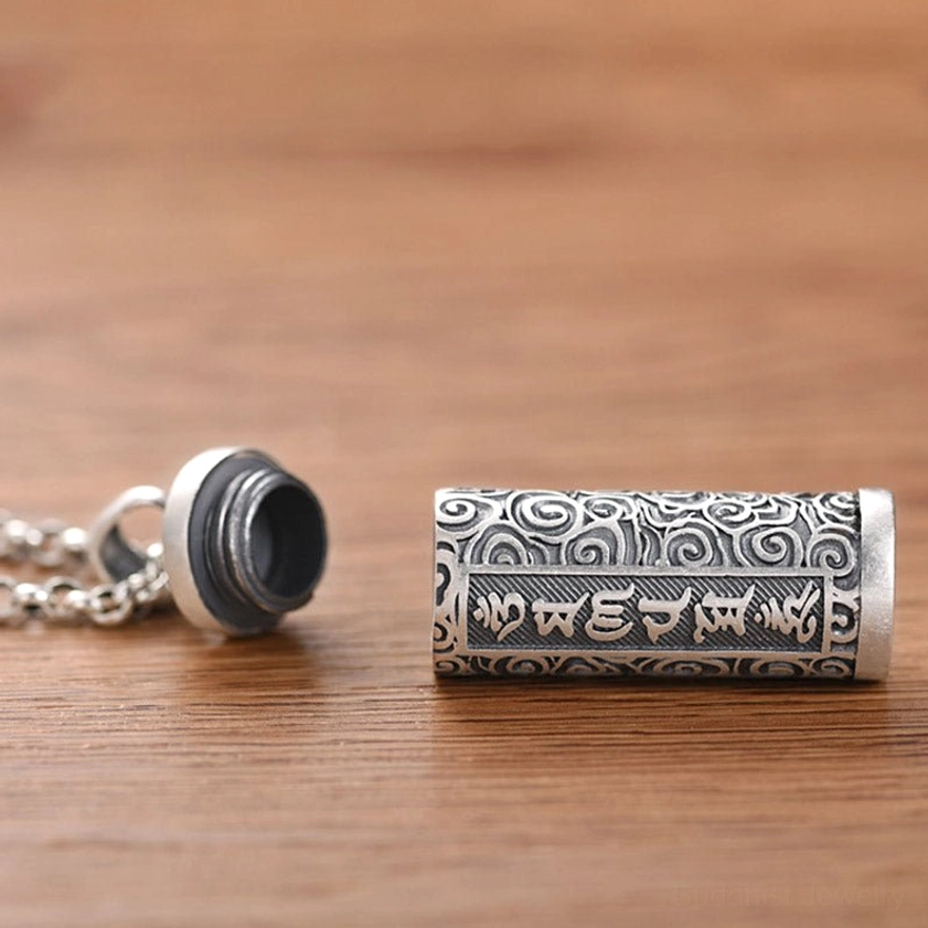 Detachable Om Mani Padme Hum pendant design - separable cap and cylinder body showing Sanskrit mantras and cloud wrap patterns
