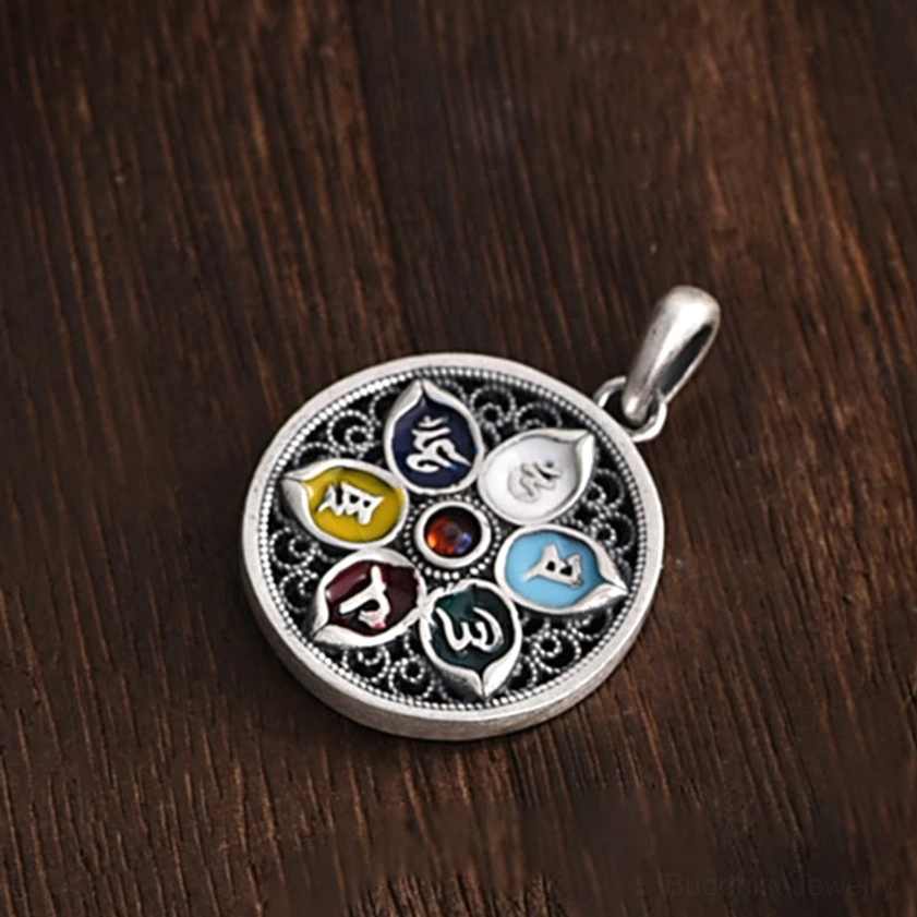 Om Mani Padme Hum Buddhist pendant necklace flat lay showing pendant front motifs and chain