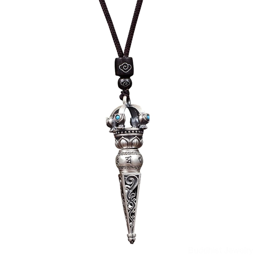 Macro close-up detail of Om Mani Padme Hum Buddhist pendant showing clear scripture carvings and hollowed floral patterns