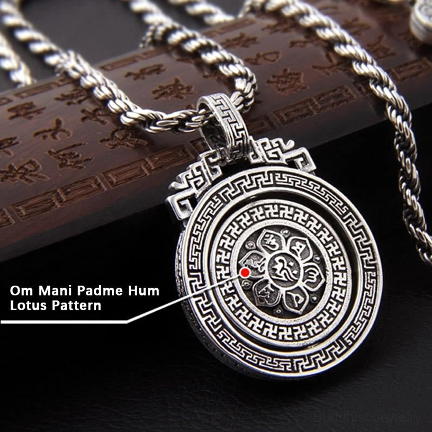 Om Mani Padme Hum Buddhist necklace pendant detail shot showing Sanskrit mantra engraving and silver patina