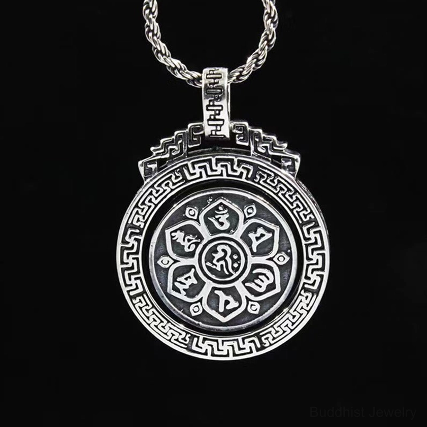 Six syllable Om Mani Padme Hum Buddhist pendant overhead view with Sanskrit mantra and central lotus mandala