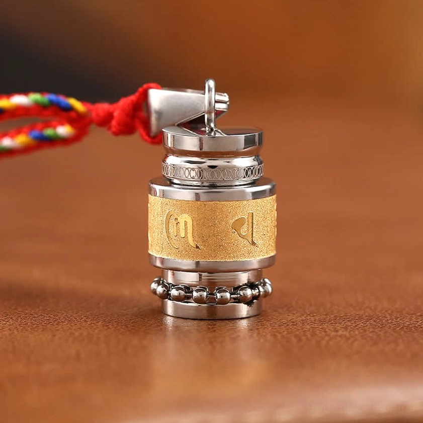 Om Mani Padme Hum pendant side view detail showing beaded silver lower trim red lanyard and stainless steel hardware