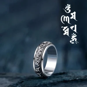 Om Mani Padme Hum PiXiu rotatable buddhist ring side profile view with antique silver finish and engraved mantras on dark stone background