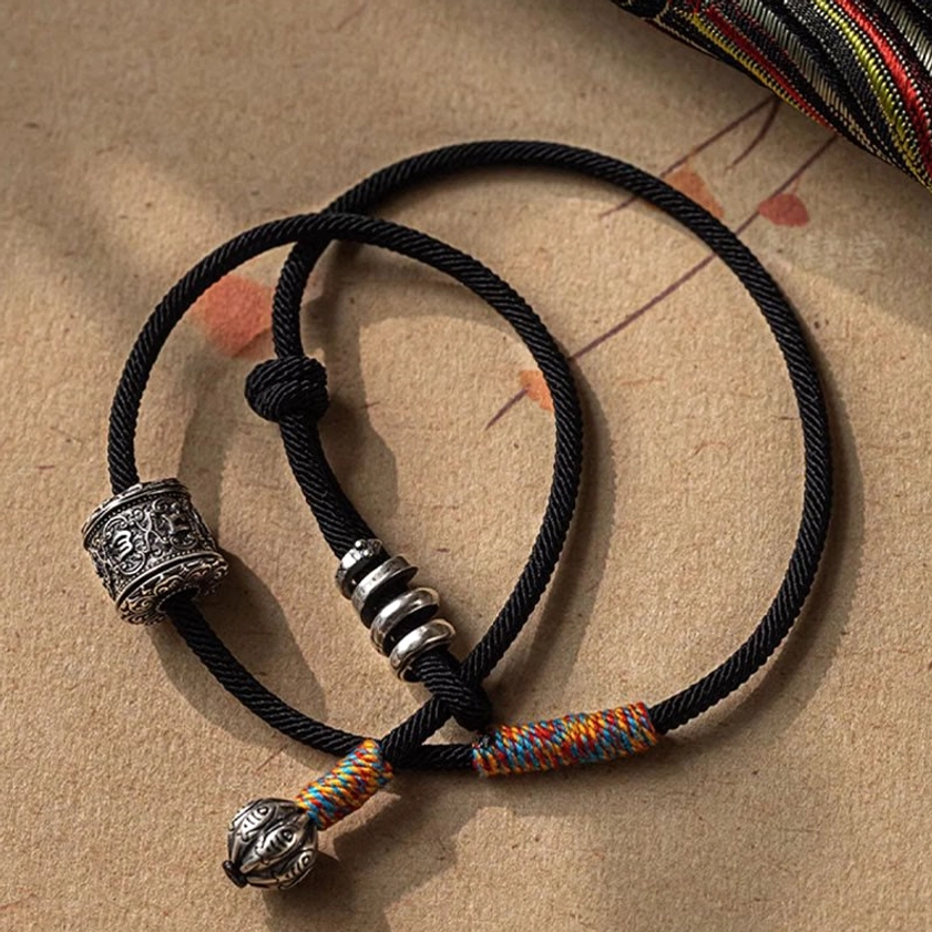 Buddhist prayer bracelet with carved Om Mani Padme Hum beads for mindfulness and spiritual practice