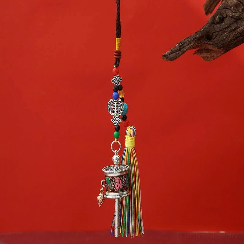 Antique red copper Om Mani Padme Hum prayer wheel keychain with warm copper tone and multicolor tassel