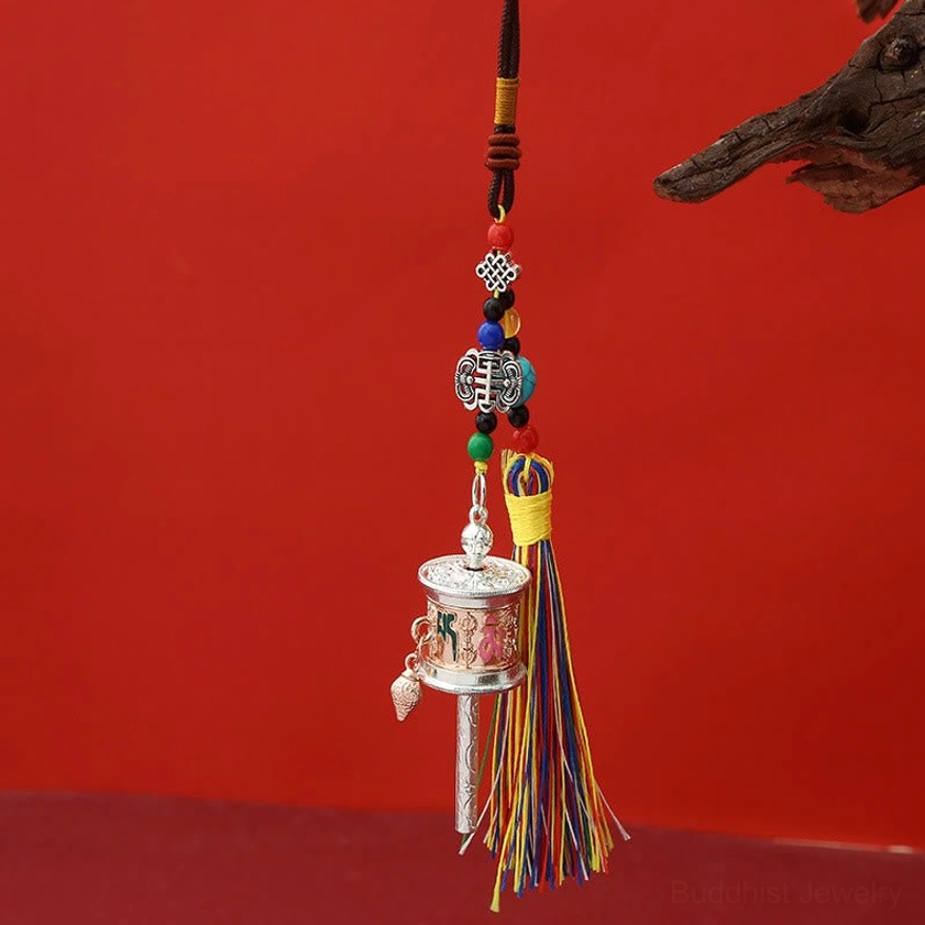 Rose gold Om Mani Padme Hum prayer wheel keychain with matte relief engravings and multicolored tassels