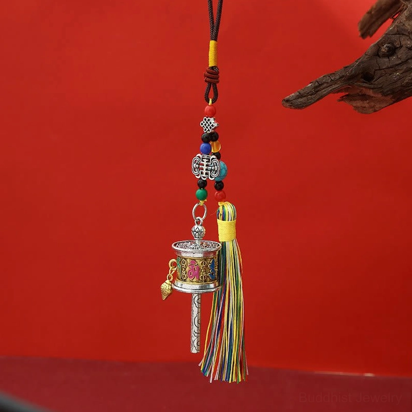 Vintage gold finish Om Mani Padme Hum prayer wheel keychain with patina style and multicolor tassels