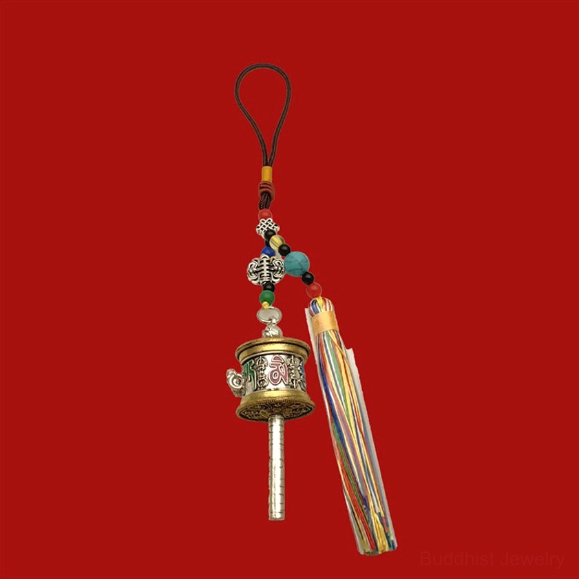Vintage silver Om Mani Padme Hum prayer wheel keychain with matte relief engravings and colorful tassels