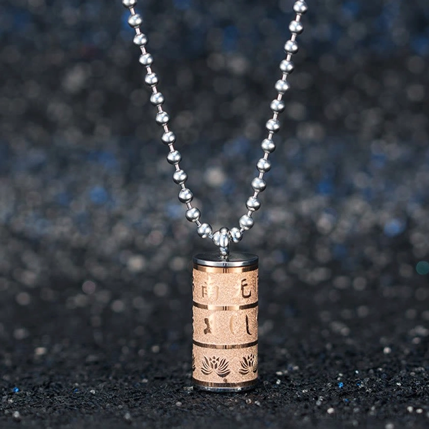 Buddhist prayer wheel pendant necklace showing chain detail and secure attachment point, titanium steel construction with Om Mani Padme Hum and lotus motif engravings