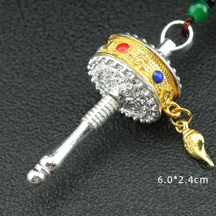 Om Mani Padme Hum prayer wheel tassel with six syllable mantra Buddhist compassion symbol