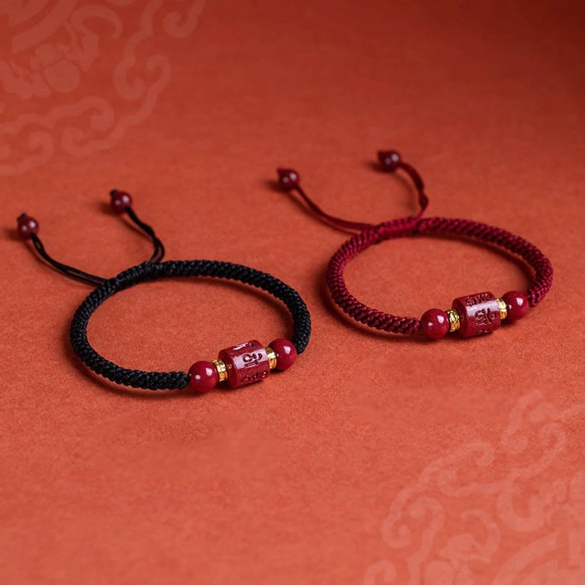 Buddhist red string bracelet with Om Mani Padme Hum engraved charm designed for meditation, protection, and daily spiritual practice