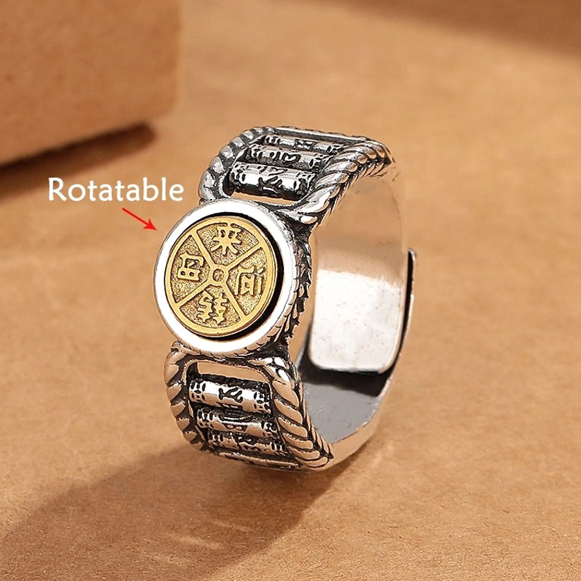 Om Mani Padme Hum rotatable Buddhist ring front view with carved copper coin disc and twisted rope border