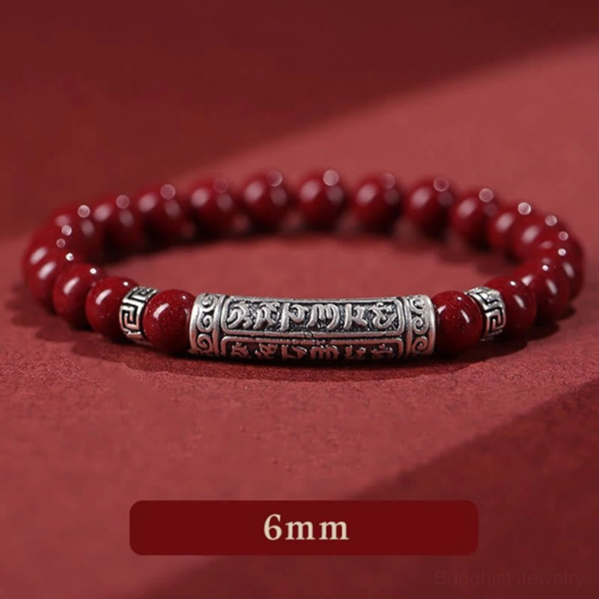 Six True Words cinnabar prayer bracelet with engraved silver charm close-up detail