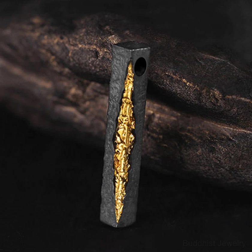 Om Mani Padme Hum sterling silver and gold necklace pendant with black oxidized finish, front close-up view showcasing carved mantra design
