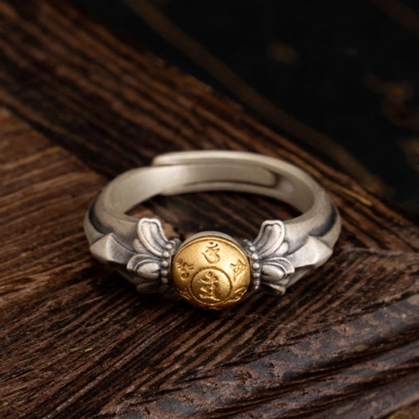 925 sterling silver Om Mani Padme Hum adjustable ring front view with engraved mantra bead on dark wooden background