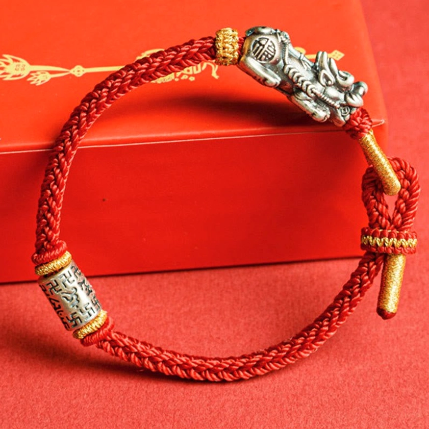 Om Mani Padme Hum engraved silver tube with adjustable red string cord Buddhist bracelet front view